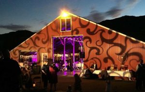 Use a patterned gobo projected across the facade of your venue for your outdoor wedding lighting.