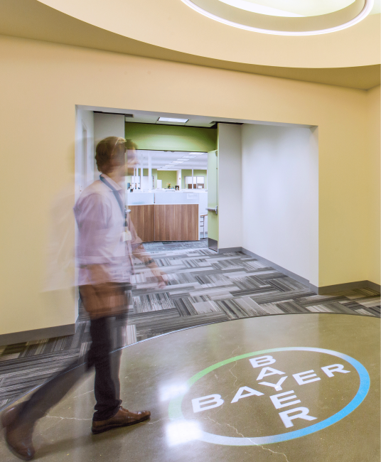 Use motion sensors with gobo projectors to trigger your logo to appear when someone walks past.  