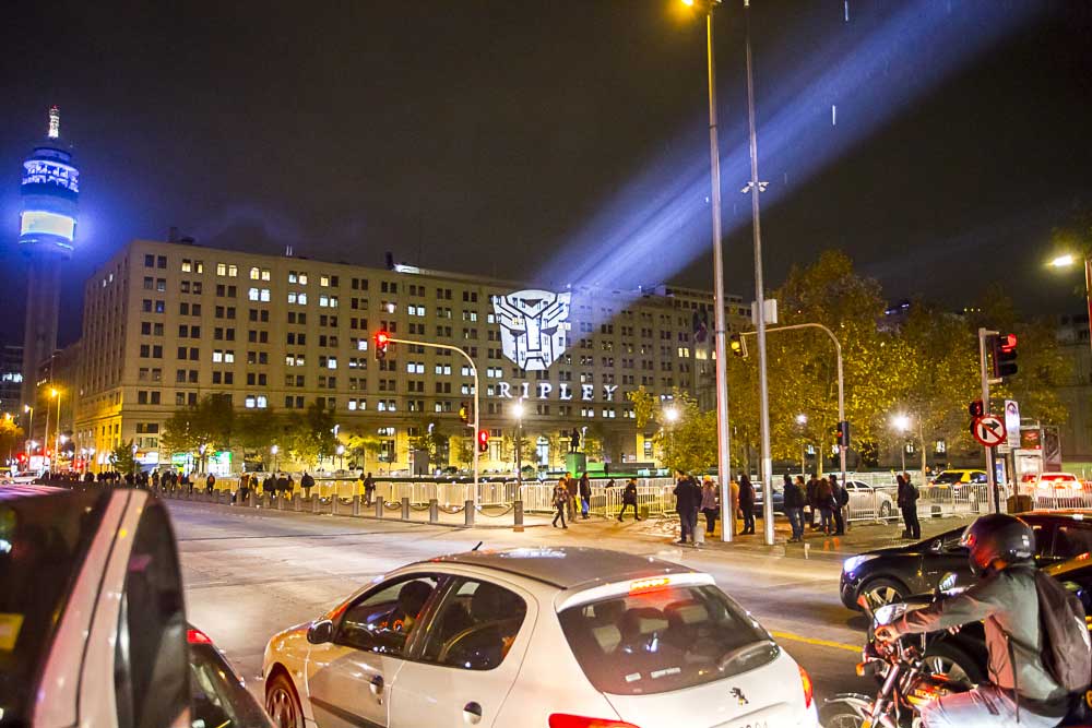 Outdoor logo projection across a large building.