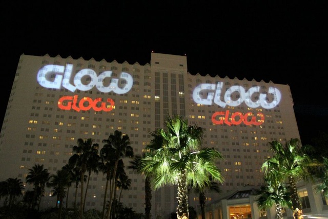 Branded signage like this exterior logo projection is critical for workplace branding